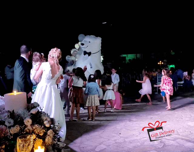 The White Polar Bear came to the wedding to deliver the gift to the bride and groom. Gift Delivery. Wedding gift. Surprise from the Political bear. White Polar Bear at the wedding.